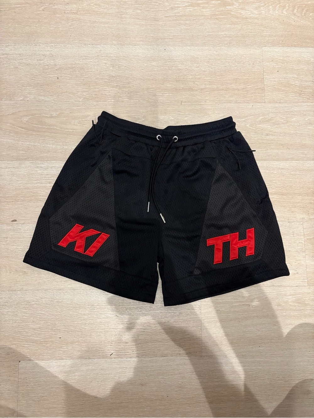 Kith Black Athletic Mesh Shorts with Red Appliqués